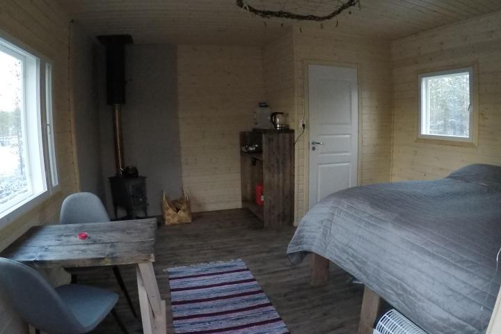 a room filled with furniture and a large window