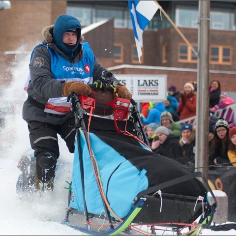 a person riding skis down a snow covered slope