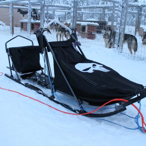 a person lying on top of a snow covered slope