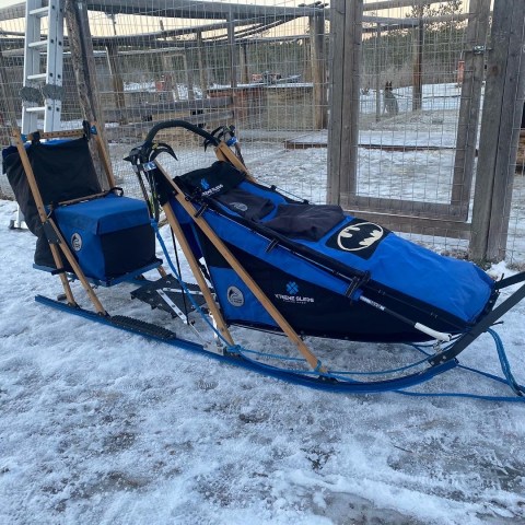 a pile of luggage sitting on the snow