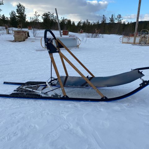 a boat sitting on top of a snow covered field