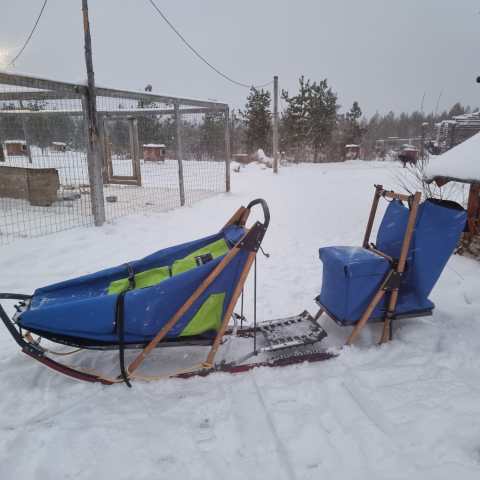 a sign on the side of a snow covered slope